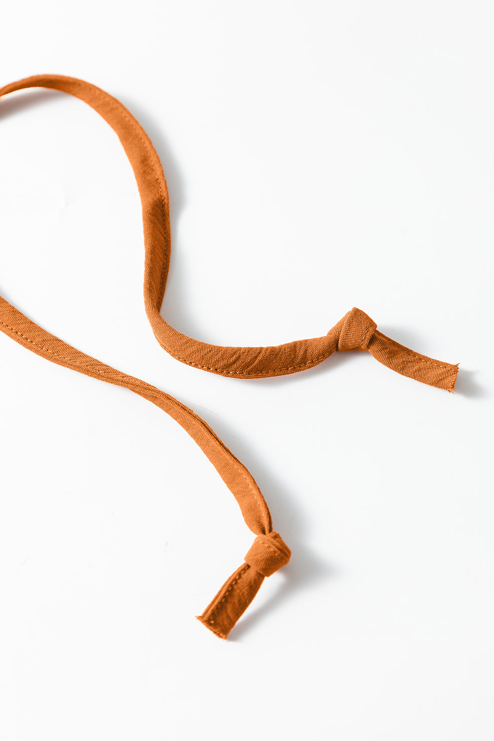 Wholesale Apricot Spaghetti Straps Waist Tie Pocketed Wide Leg Jumpsuit